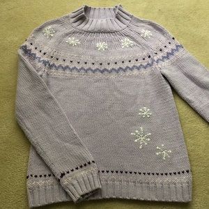 Light purple cable knit sweater with snowflakes